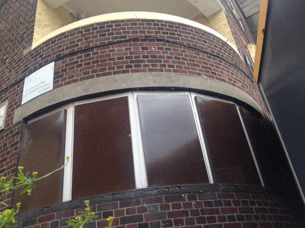 Security screens fitted to a building